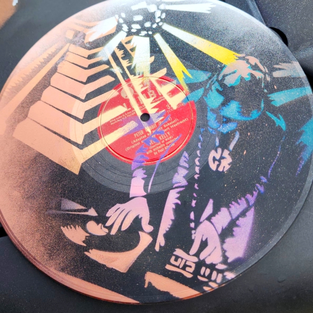 Custom painted vinyl record with dj and pyramid